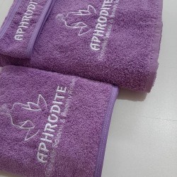 Mor havlu seti logolu güzellik merkezi için özel imalatımız toptan alış fiyatları için bize ulaşabilirsiniz